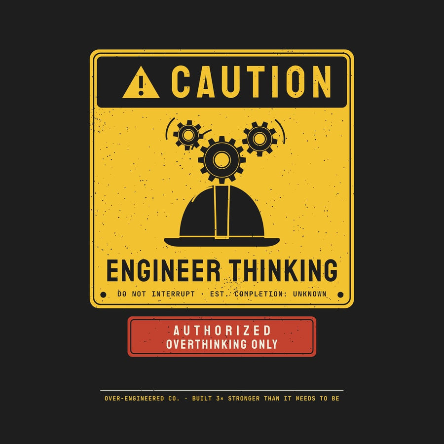 Close-up of the Caution Engineer Thinking artwork showing the hard hat, the turning gears and the sign lettering.
