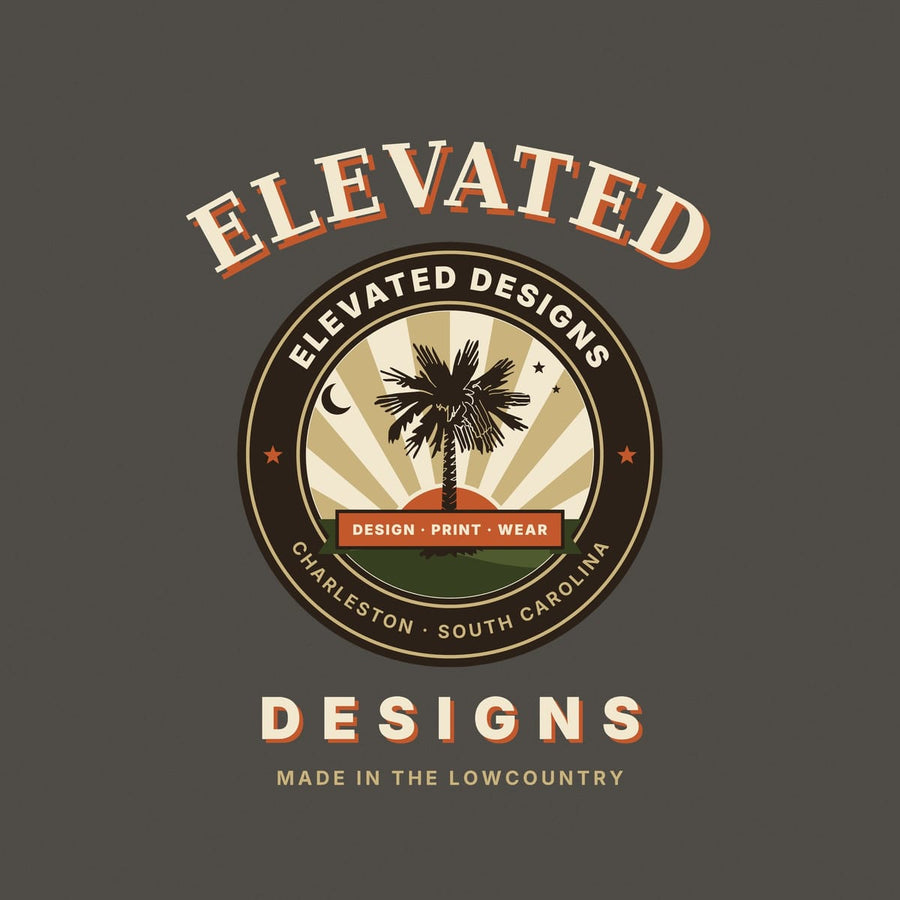 Close-up of the Elevated Designs crest: a dark palmetto tree over tan sunburst rays and an orange sun, a crescent moon and two stars, and the rust DESIGN · PRINT · WEAR banner over an olive hill.