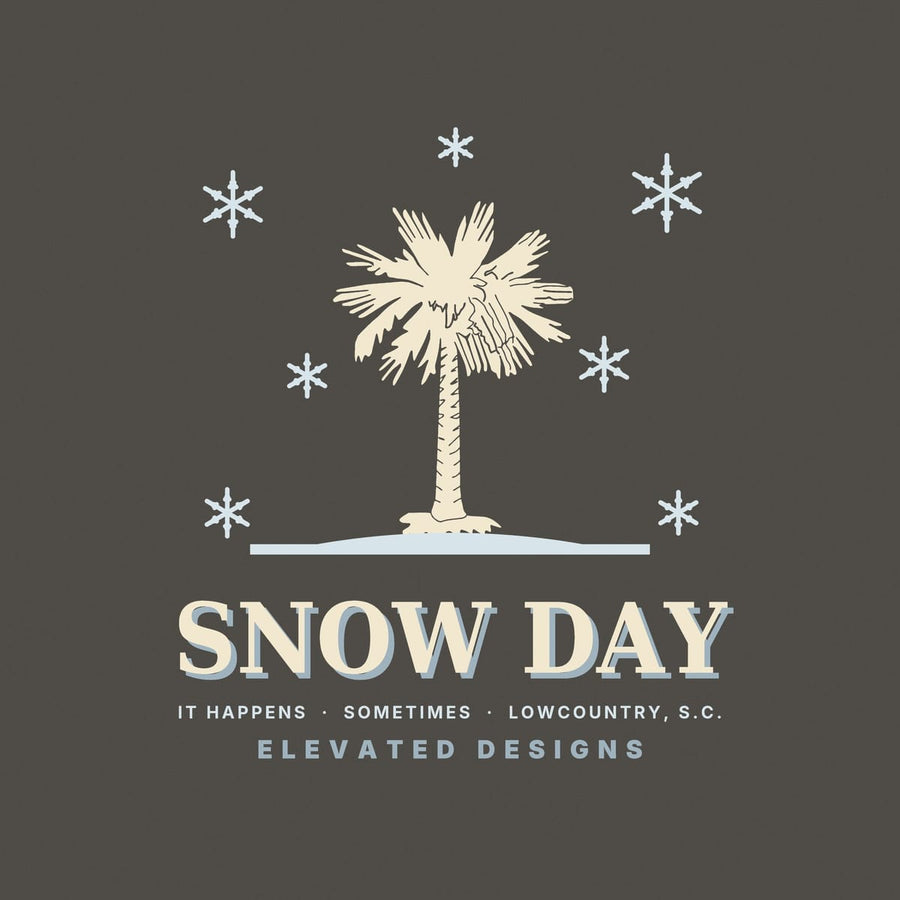 Close-up of the Snow Day print: a sketchy cream palmetto on a pale blue ground line with pale blue snowflakes and cream lettering with a blue shadow.